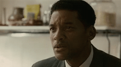 Man In Suit And Tie Looking At Camera Close Up GIF