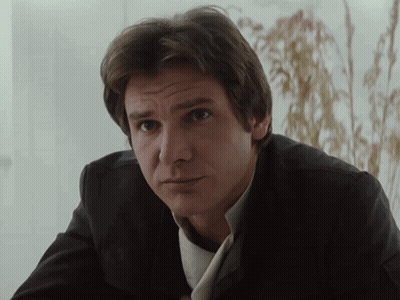 Man In Suit And Tie Looking At Camera GIF