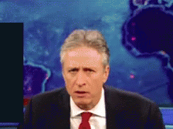 Man In Suit And Tie Looking At Camera GIF