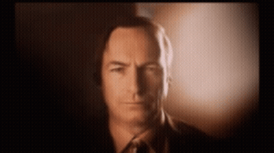Man In Suit And Tie Looking At Camera GIF