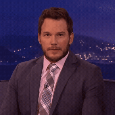 Man In Suit And Tie Looking At Camera GIF