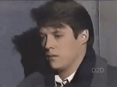Man In Suit And Tie Looking At Camera GIF