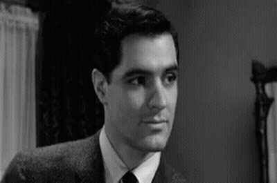 Man In Suit And Tie Looking At Camera GIF