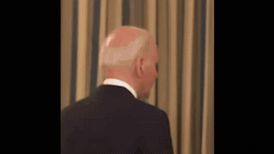 Man In Suit And Tie Looking At Camera GIF