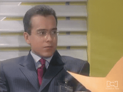 Man In Suit And Tie Looking At Paper GIF