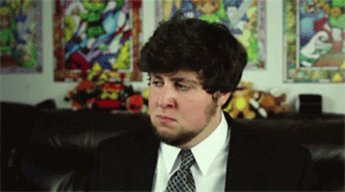 Man In Suit And Tie Looking At Something GIF