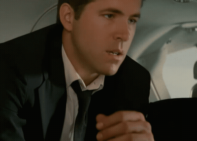 Man In Suit And Tie Looking At Something GIF