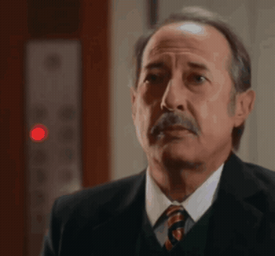 Man In Suit And Tie Looking At Something GIF