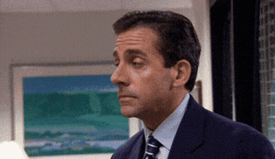 Man In Suit And Tie Looking At Something GIF
