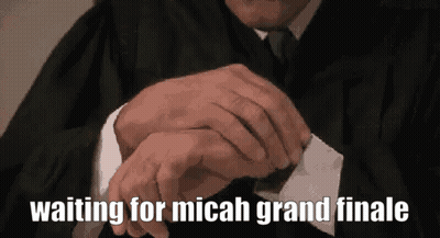 Man In Suit And Tie Looking At Watch Saying Waiting For Micah Grand Finale GIF