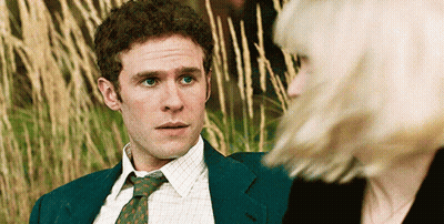 Man In Suit And Tie Looking At Woman GIF