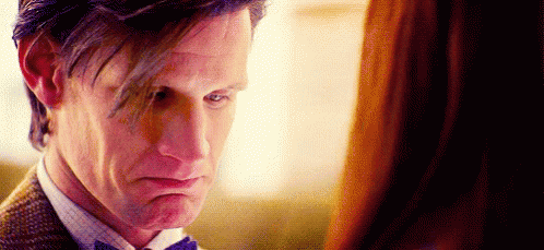 Man In Suit And Tie Looking At Woman GIF