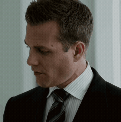 Man In Suit And Tie Looking Down GIF