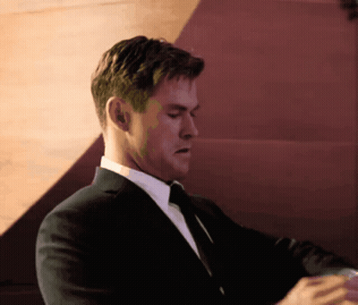 Man In Suit And Tie Looking Down GIF