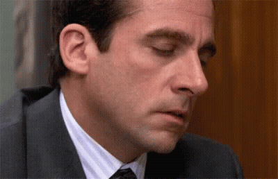 Man In Suit And Tie Looking Down GIF