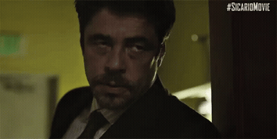 Man In Suit And Tie Looking In Doorway GIF