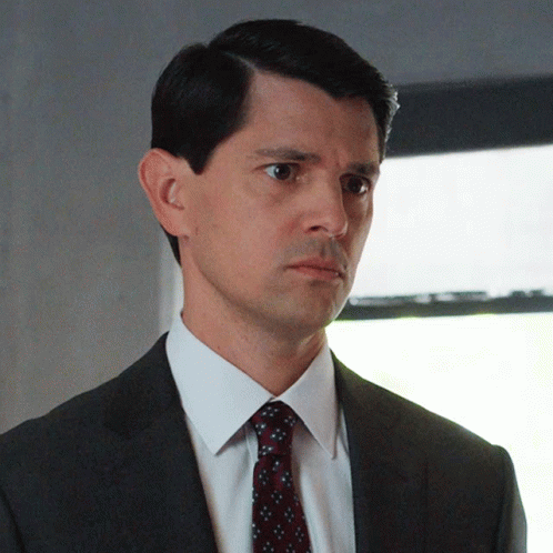 Man In Suit And Tie Looking Left GIF