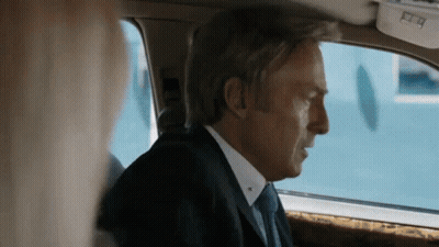Man In Suit And Tie Looking Out Car Window GIF