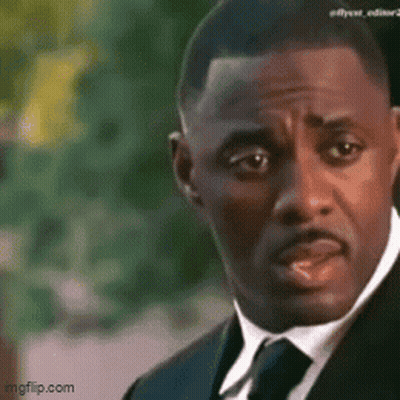 Man In Suit And Tie Looking Serious GIF