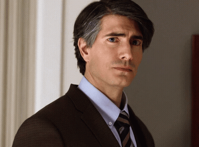 Man In Suit And Tie Looking Sideways GIF