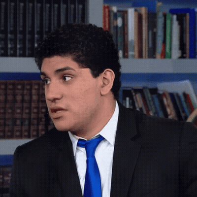 Man In Suit And Tie Looking To Side GIF