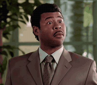 Man In Suit And Tie Looks Surprised GIF