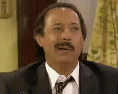 Man In Suit And Tie Making A Face GIF
