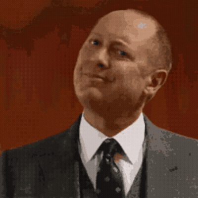 Man In Suit And Tie Making A Face GIF