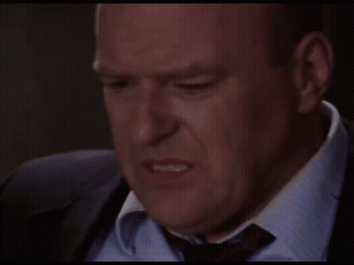 Man In Suit And Tie Making A Face GIF