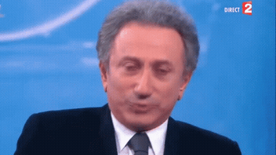 Man in Suit and Tie Making Face Direct 2