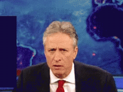Man In Suit And Tie Making Face GIF
