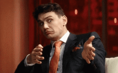 Man In Suit And Tie Making Face GIF