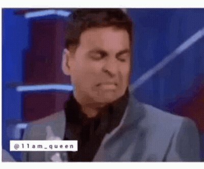 Man In Suit And Tie Making Face GIF