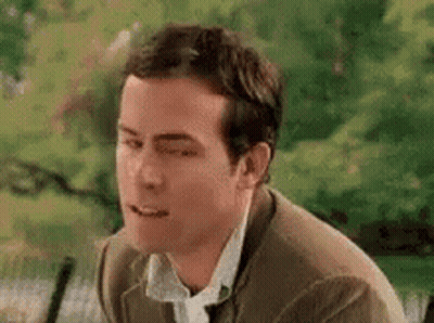 Man In Suit And Tie Making Funny Face GIF