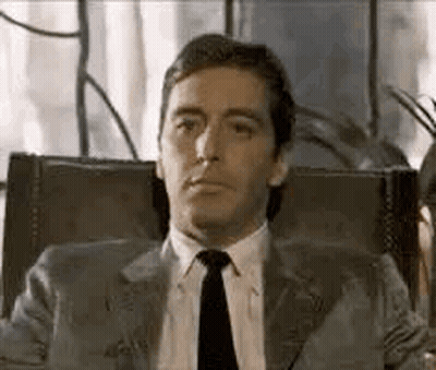Man In Suit And Tie Making Funny Face GIF