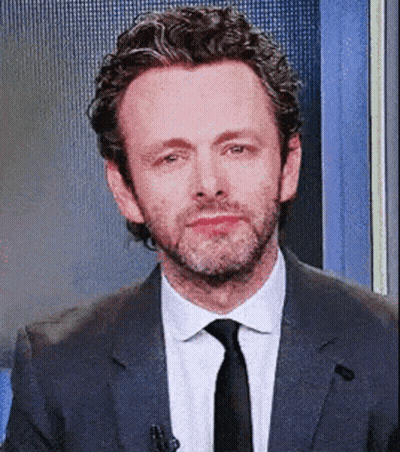 Man In Suit And Tie Making Funny Face GIF