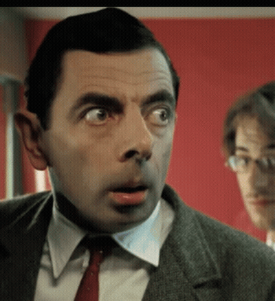 Man In Suit And Tie Making Funny Face GIF