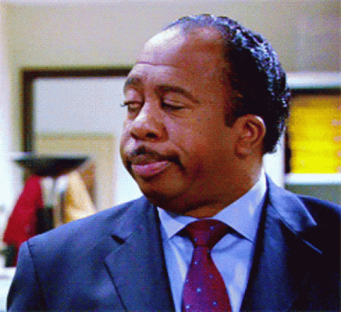 Man In Suit And Tie Making Funny Face GIF
