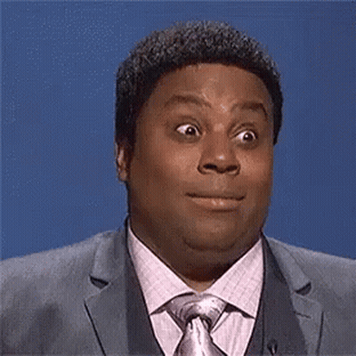 Man In Suit And Tie Making Funny Face GIF
