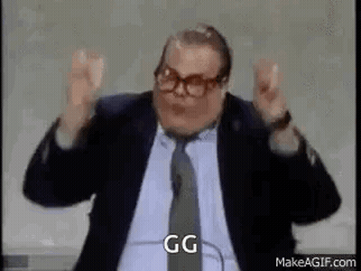 Man In Suit And Tie Making Funny Face Arms Up GIF