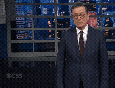 Man In Suit And Tie Making Funny Face At CBS Screen GIF