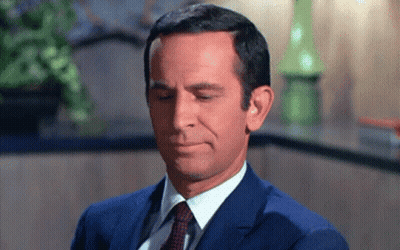 Man In Suit And Tie Making Funny Face GIF