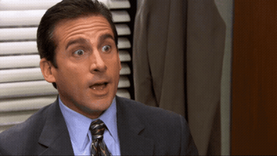 Man In Suit And Tie Making Funny Face GIF