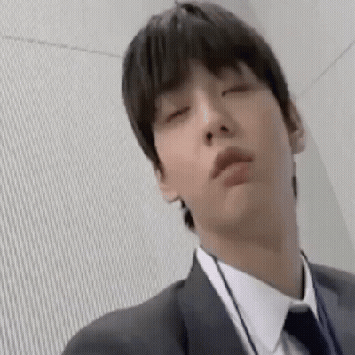 Man In Suit And Tie Making Funny Face GIF