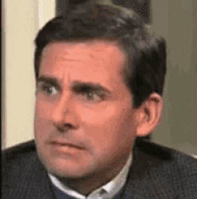Man In Suit And Tie Making Funny Face GIF
