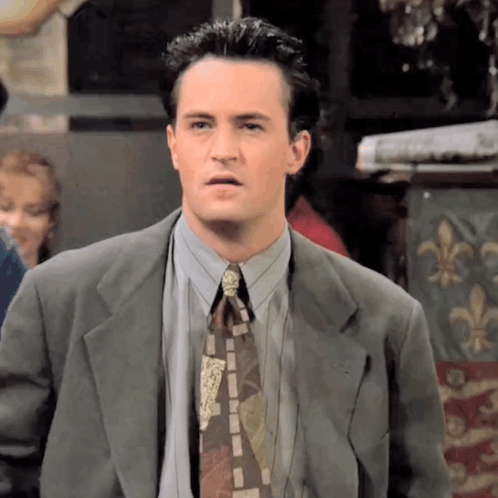 Man In Suit And Tie Making Funny Face GIF