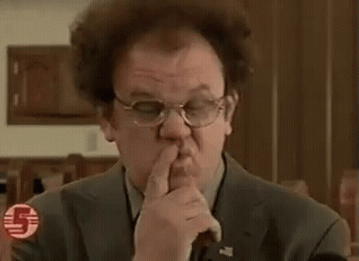 Man In Suit And Tie Making Funny Face Pointing At Camera GIF
