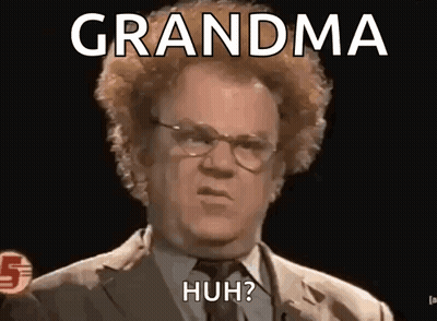 Man In Suit And Tie Making Funny Face Saying Grandma Huh GIF