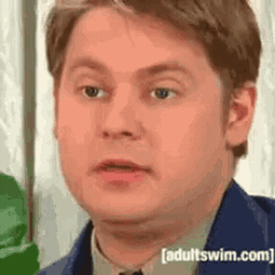Man In Suit And Tie Making Funny Face GIF