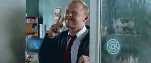 Man In Suit And Tie Making Funny Face Through Window GIF